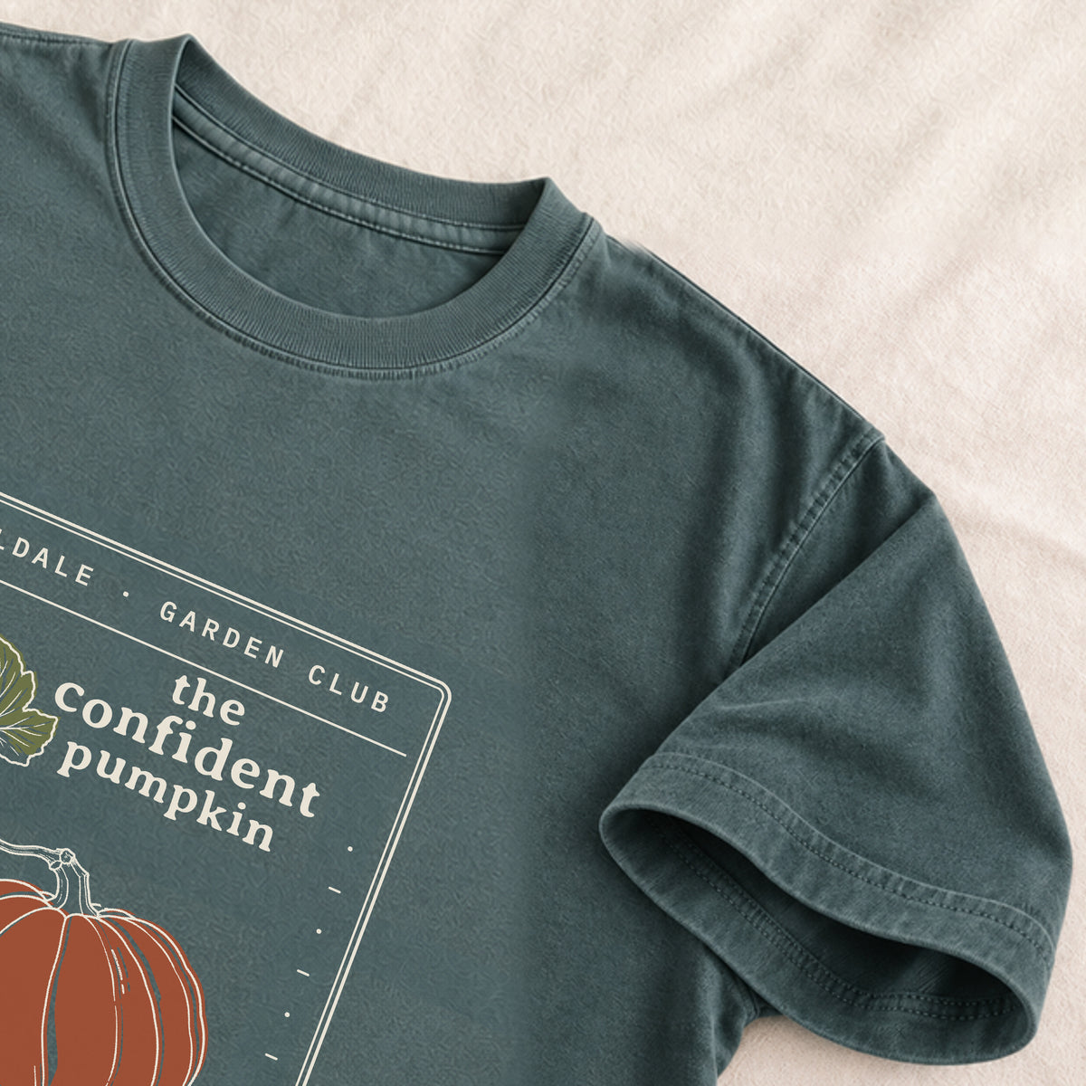 The Confident Pumpkin tee in Blue Spruce, detail