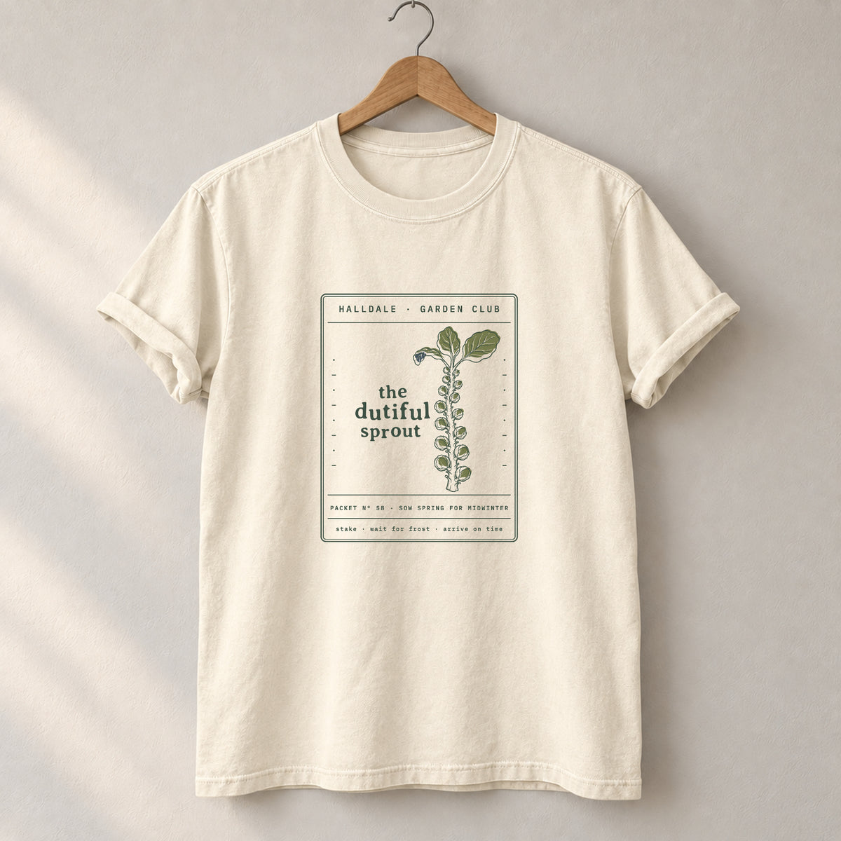 The Dutiful Sprout tee in Ivory, on a hanger