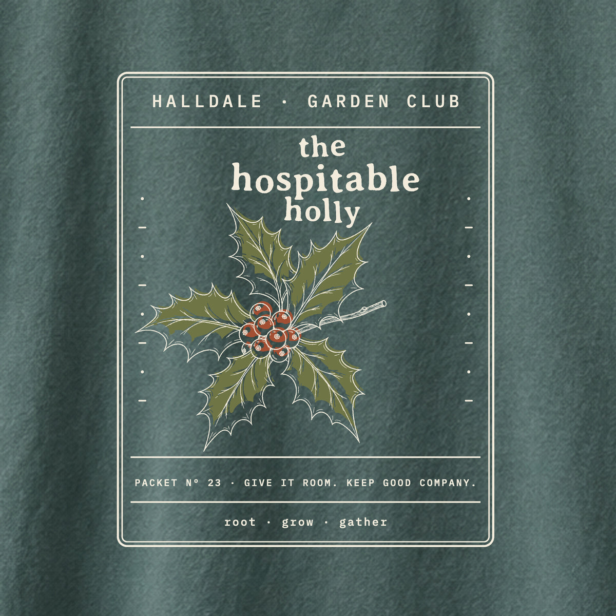 The Hospitable Holly tee in Blue Spruce, close-up of the print