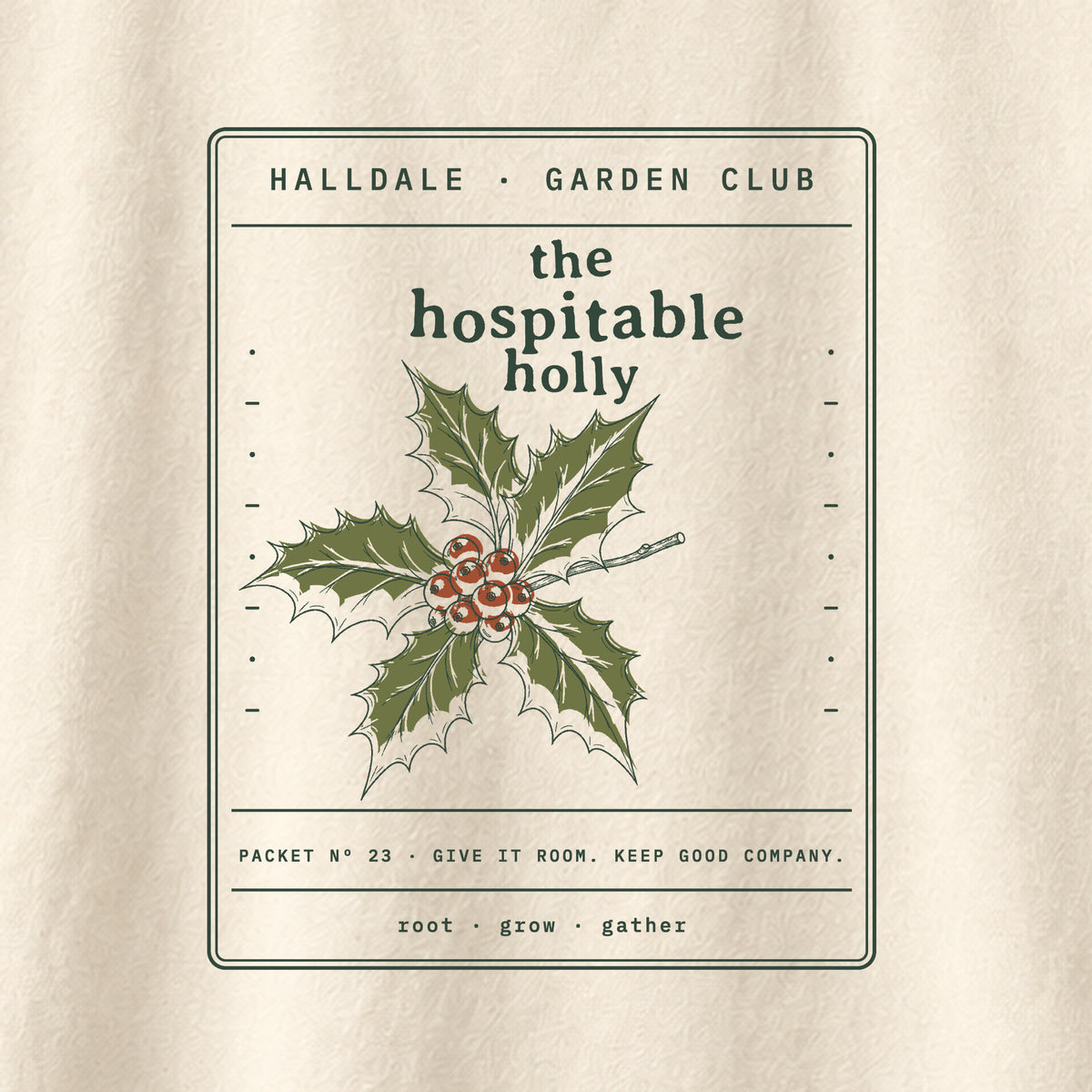 The Hospitable Holly tee in Ivory, close-up of the print