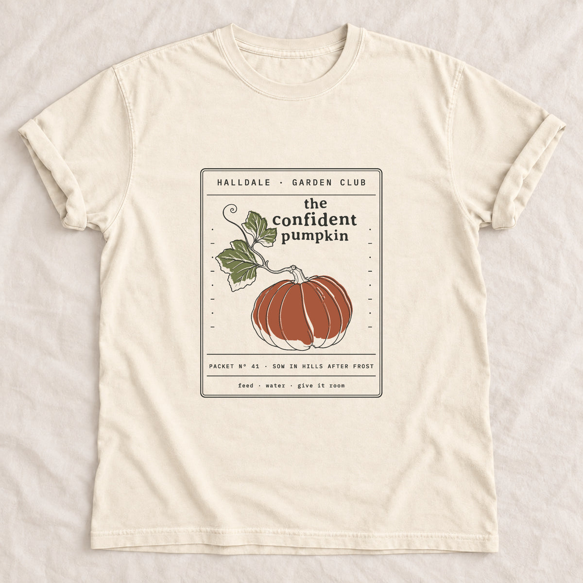 The Confident Pumpkin tee in Ivory, laid flat