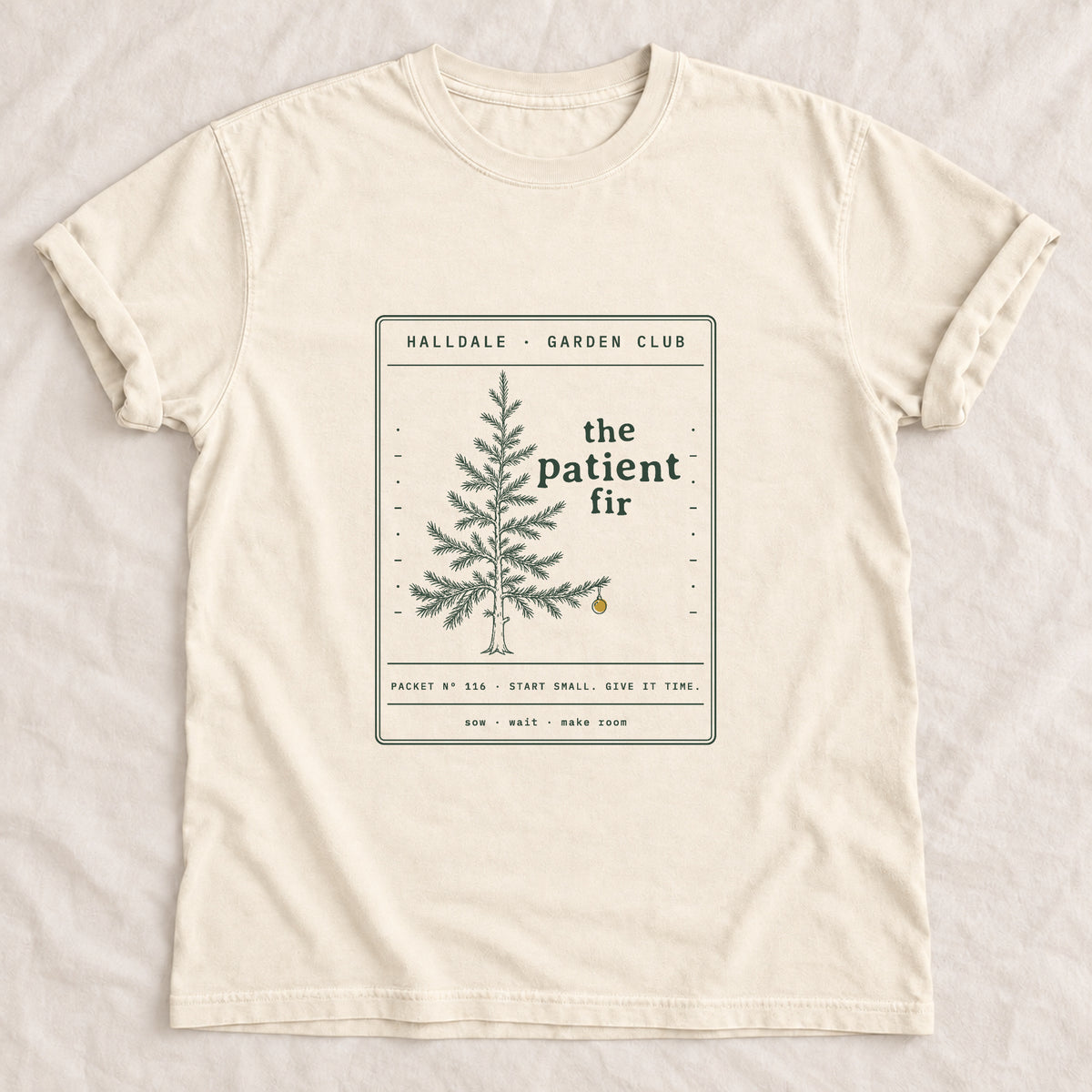 The Patient Fir tee in Ivory, laid flat