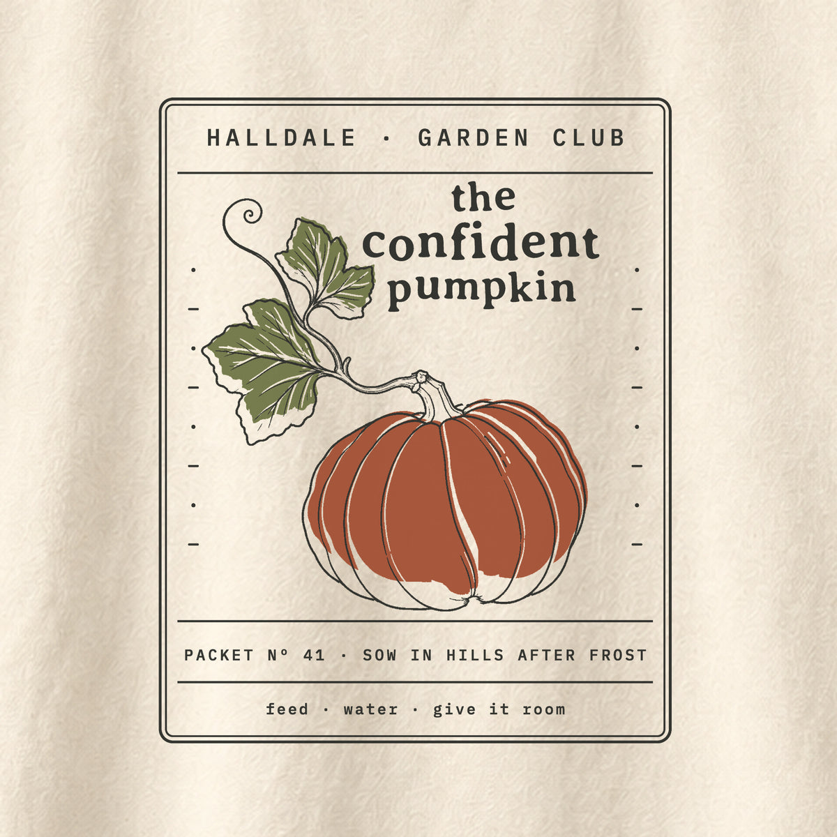 The Confident Pumpkin tee in Ivory, close-up of the print