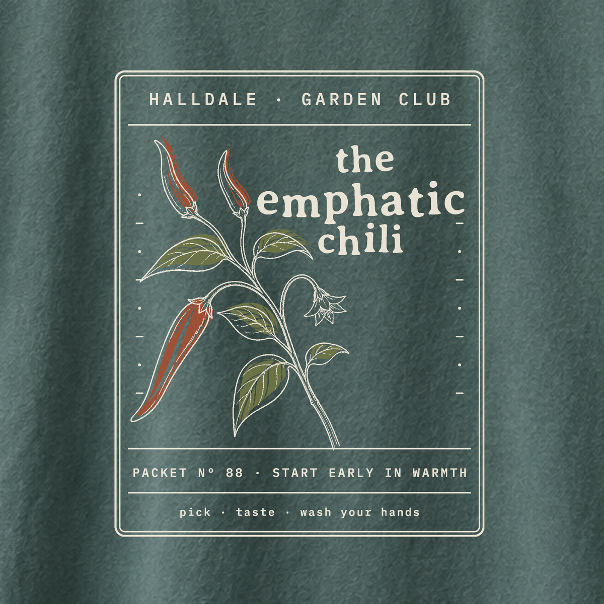 The Emphatic Chili tee in Blue Spruce, close-up of the print
