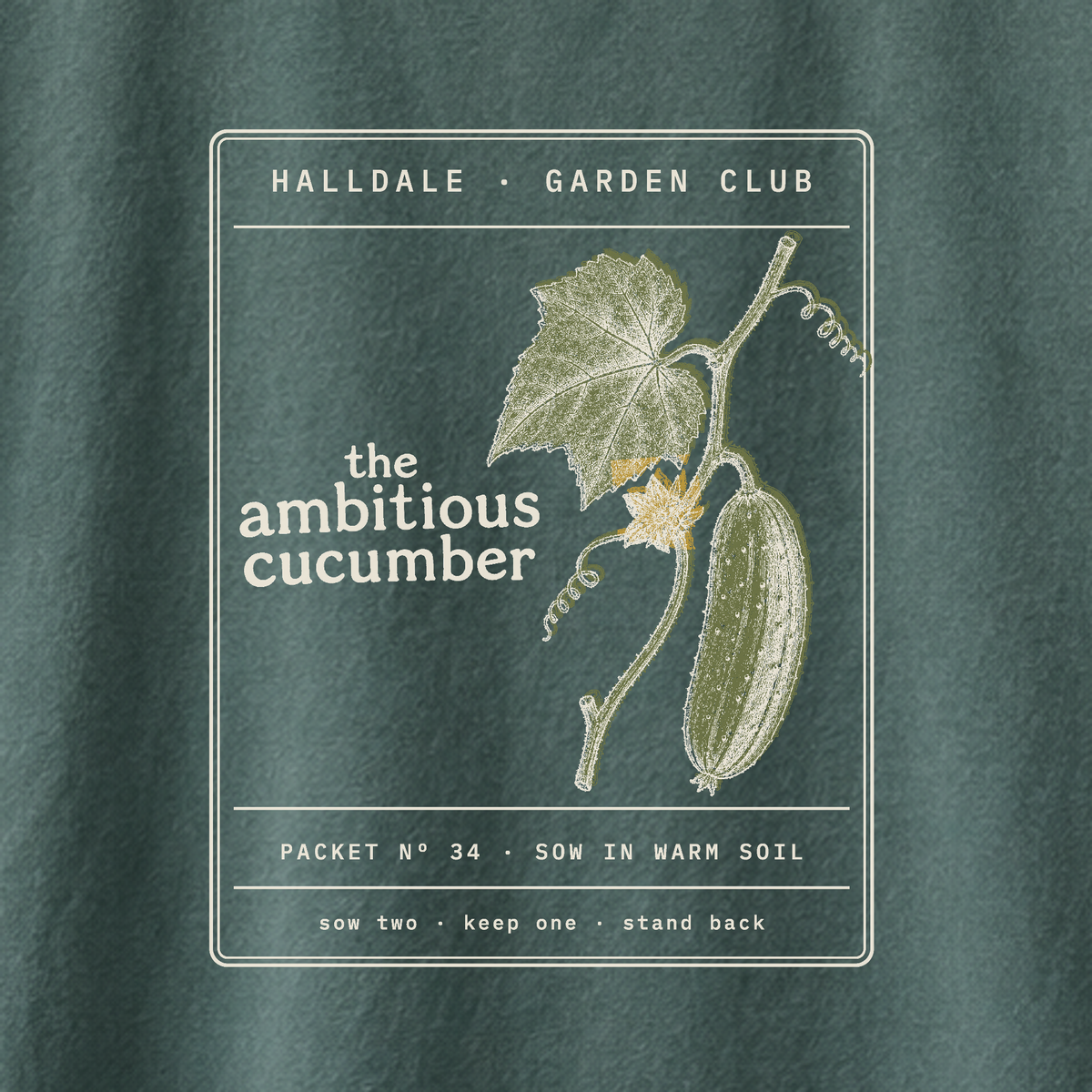 The Ambitious Cucumber tee in Blue Spruce, close-up of the print