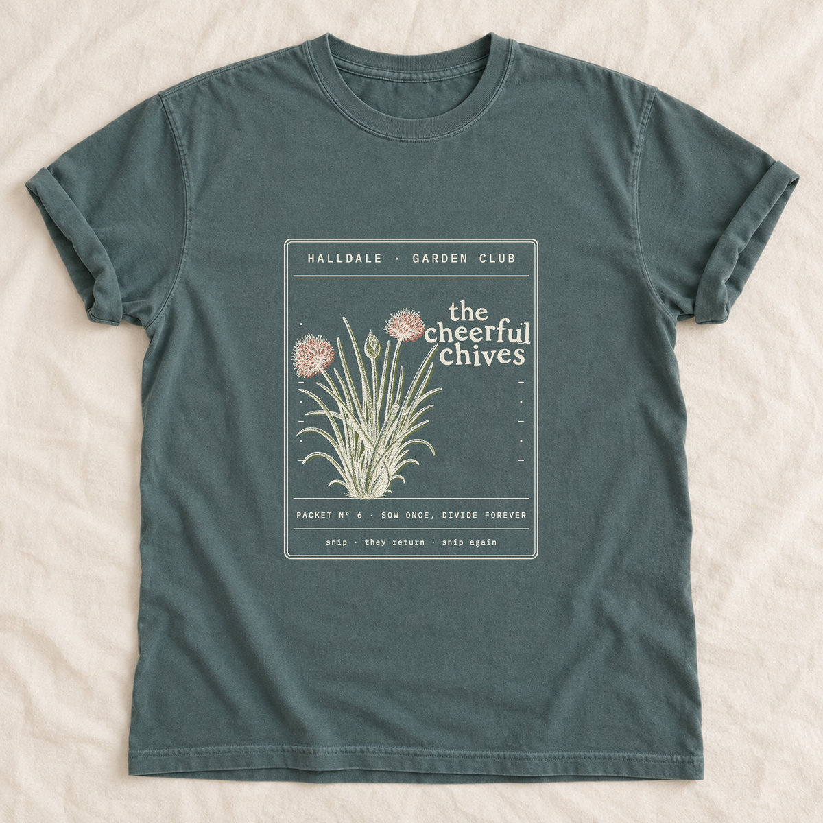The Cheerful Chives tee in Blue Spruce, laid flat