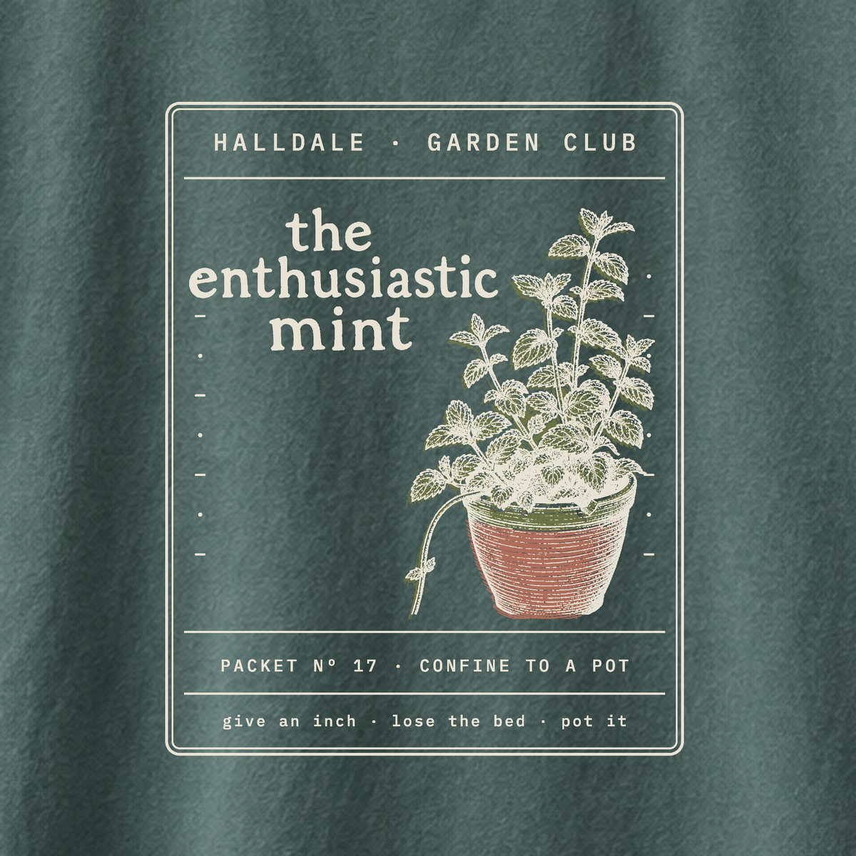 The Enthusiastic Mint tee in Blue Spruce, close-up of the print