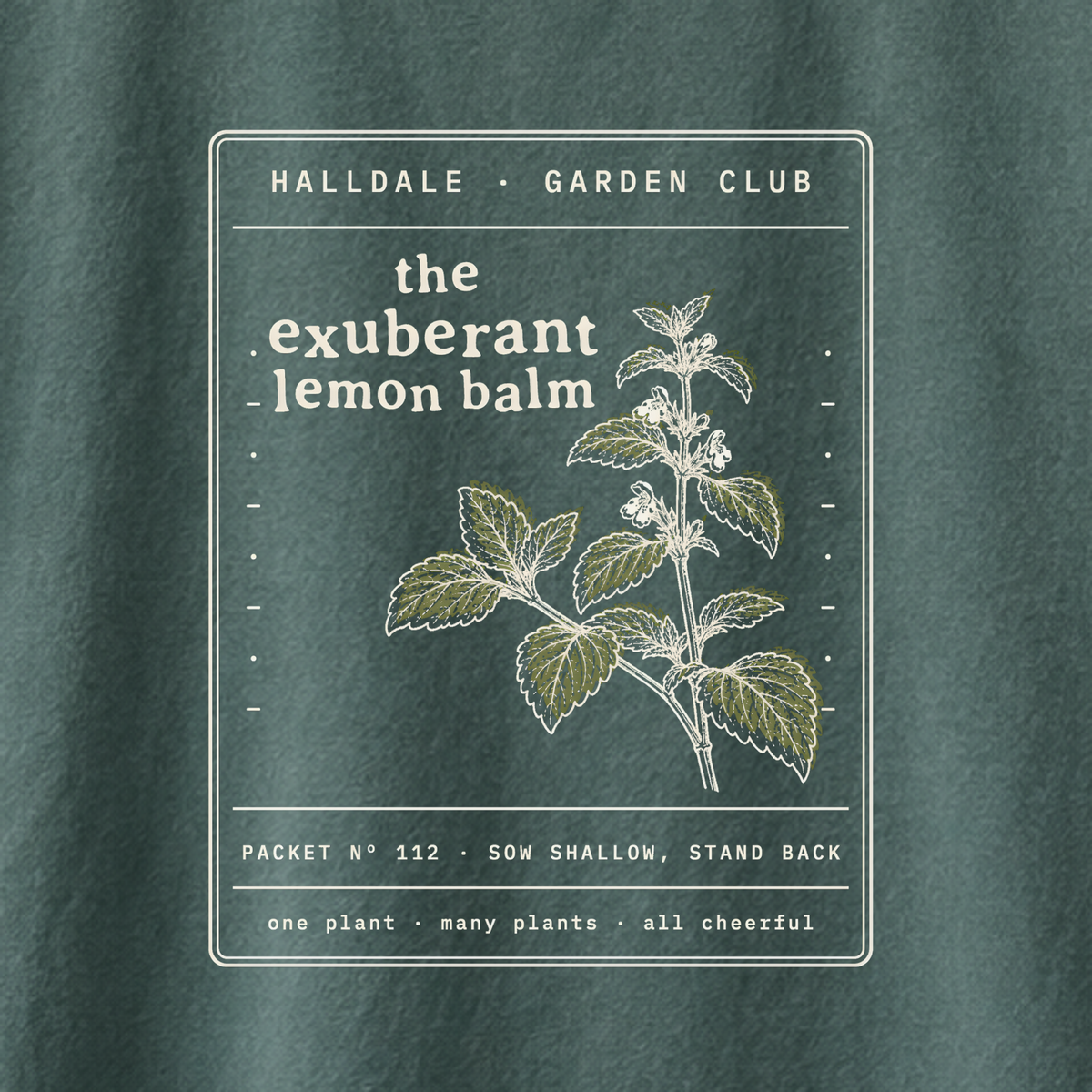 The Exuberant Lemon Balm tee in Blue Spruce, close-up of the print