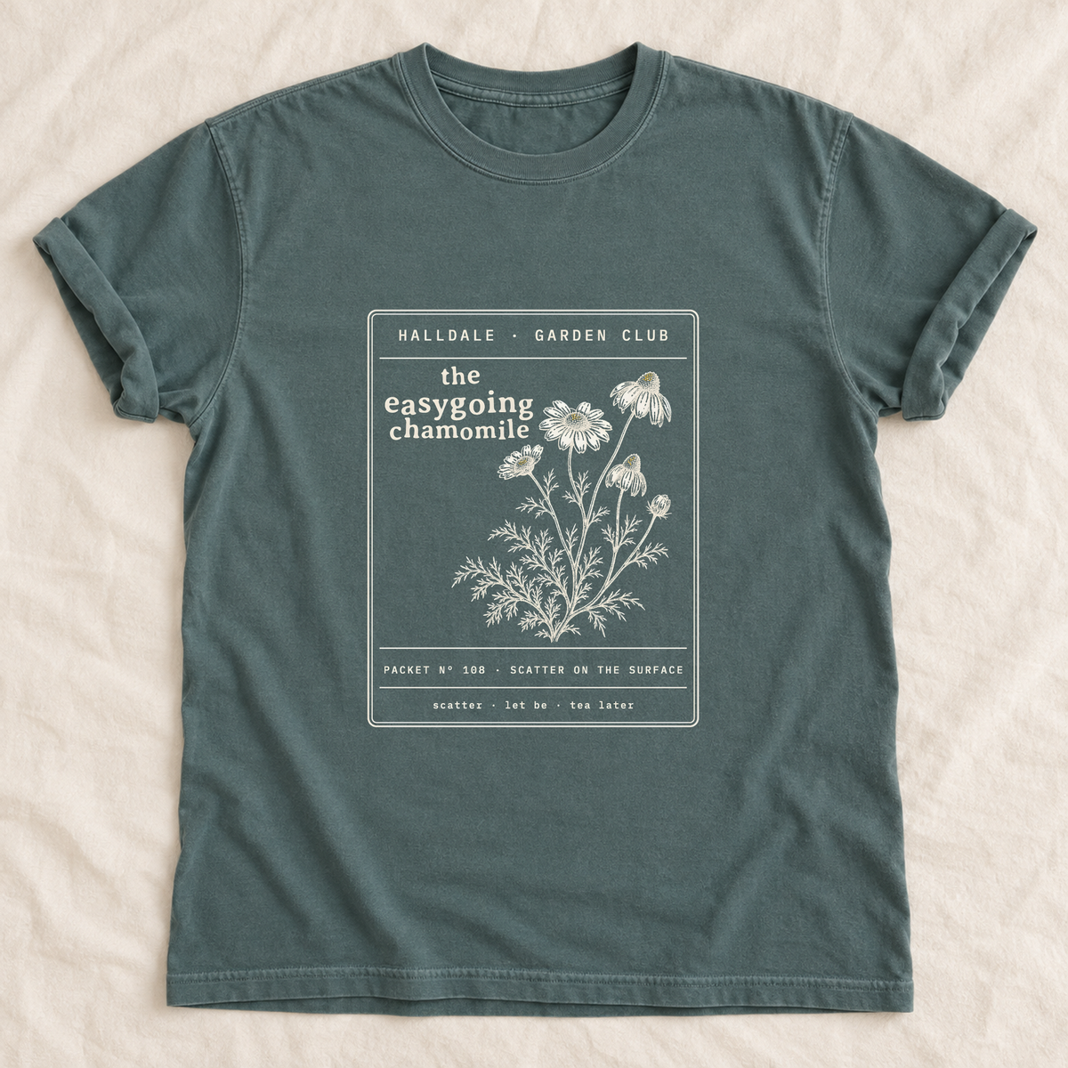 The Easygoing Chamomile tee in Blue Spruce, laid flat