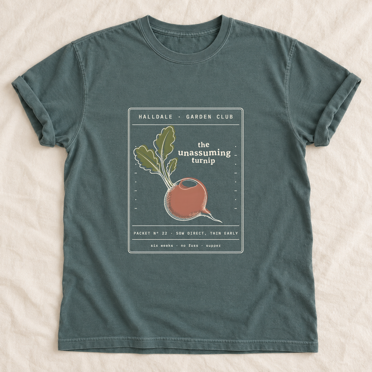 The Unassuming Turnip tee in Blue Spruce, laid flat