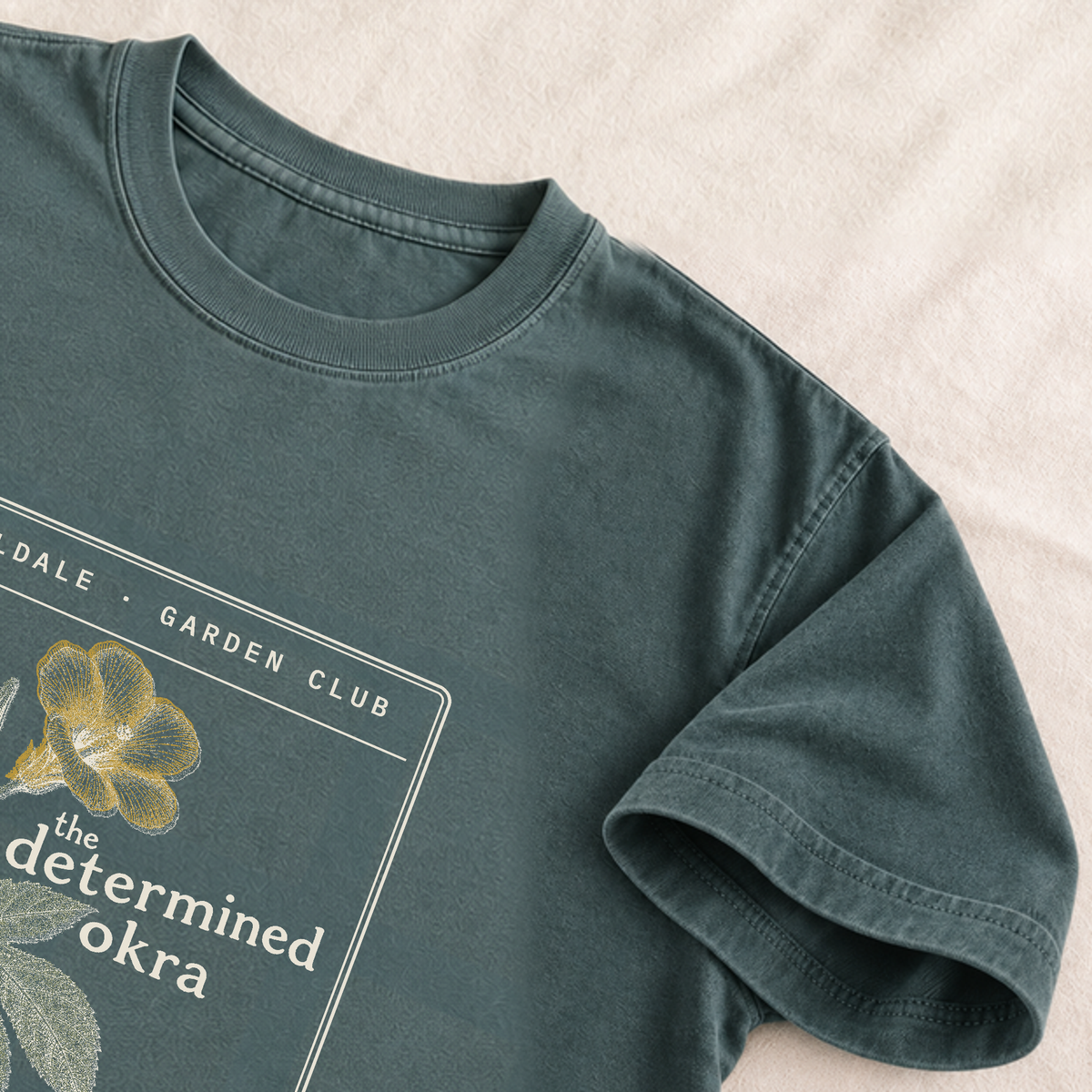 The Determined Okra tee in Blue Spruce, detail