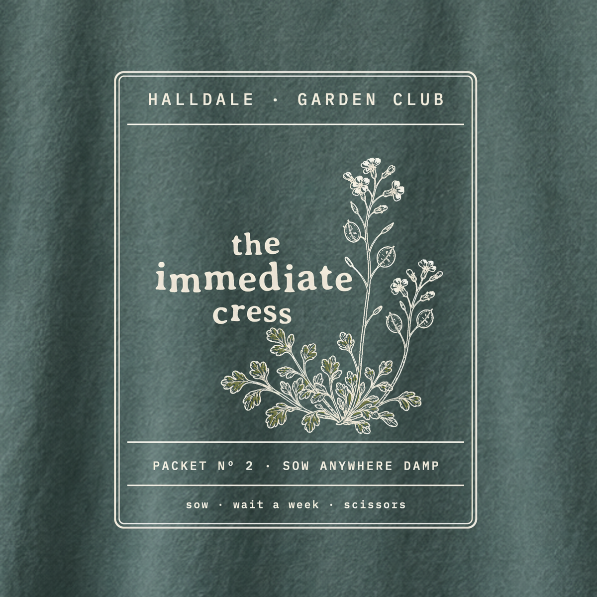 The Immediate Cress tee in Blue Spruce, close-up of the print