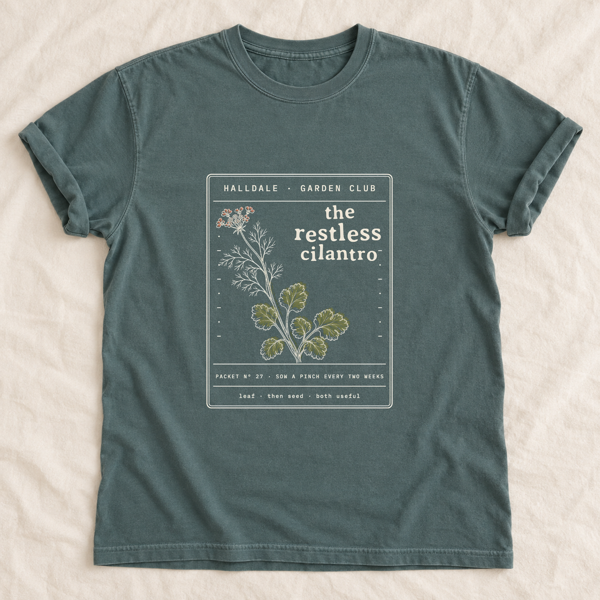 The Restless Cilantro tee in Blue Spruce, laid flat