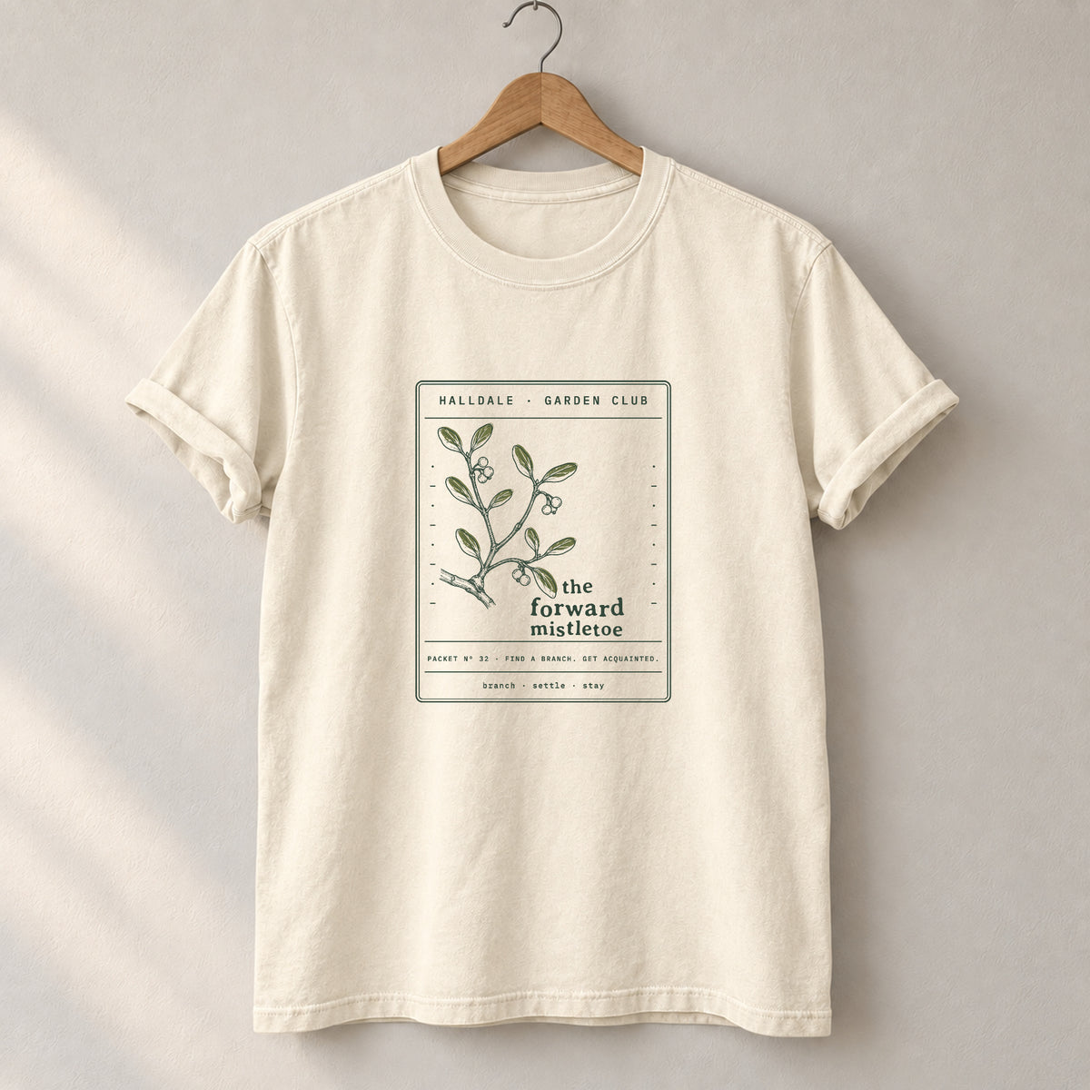 The Forward Mistletoe tee in Ivory, on a hanger