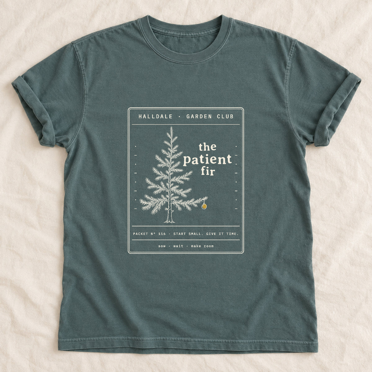 The Patient Fir tee in Blue Spruce, laid flat