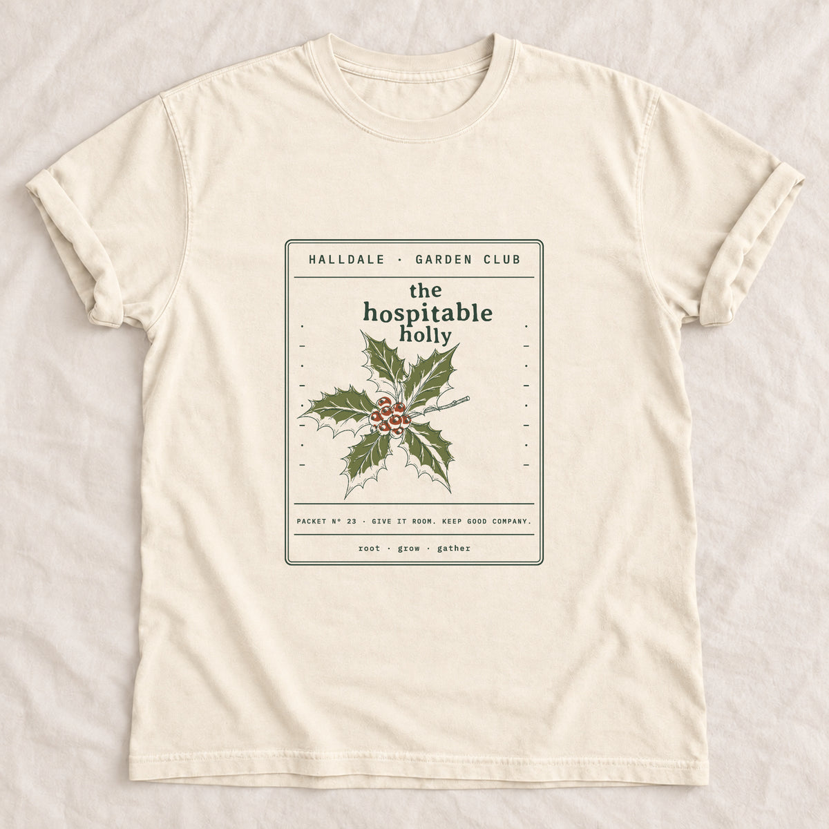 The Hospitable Holly tee in Ivory, laid flat