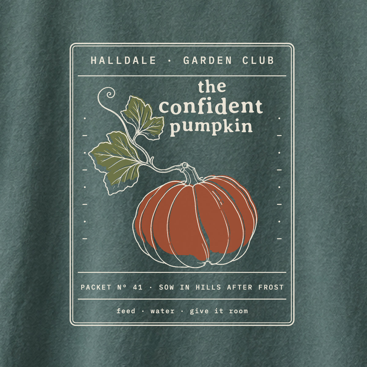 The Confident Pumpkin tee in Blue Spruce, close-up of the print