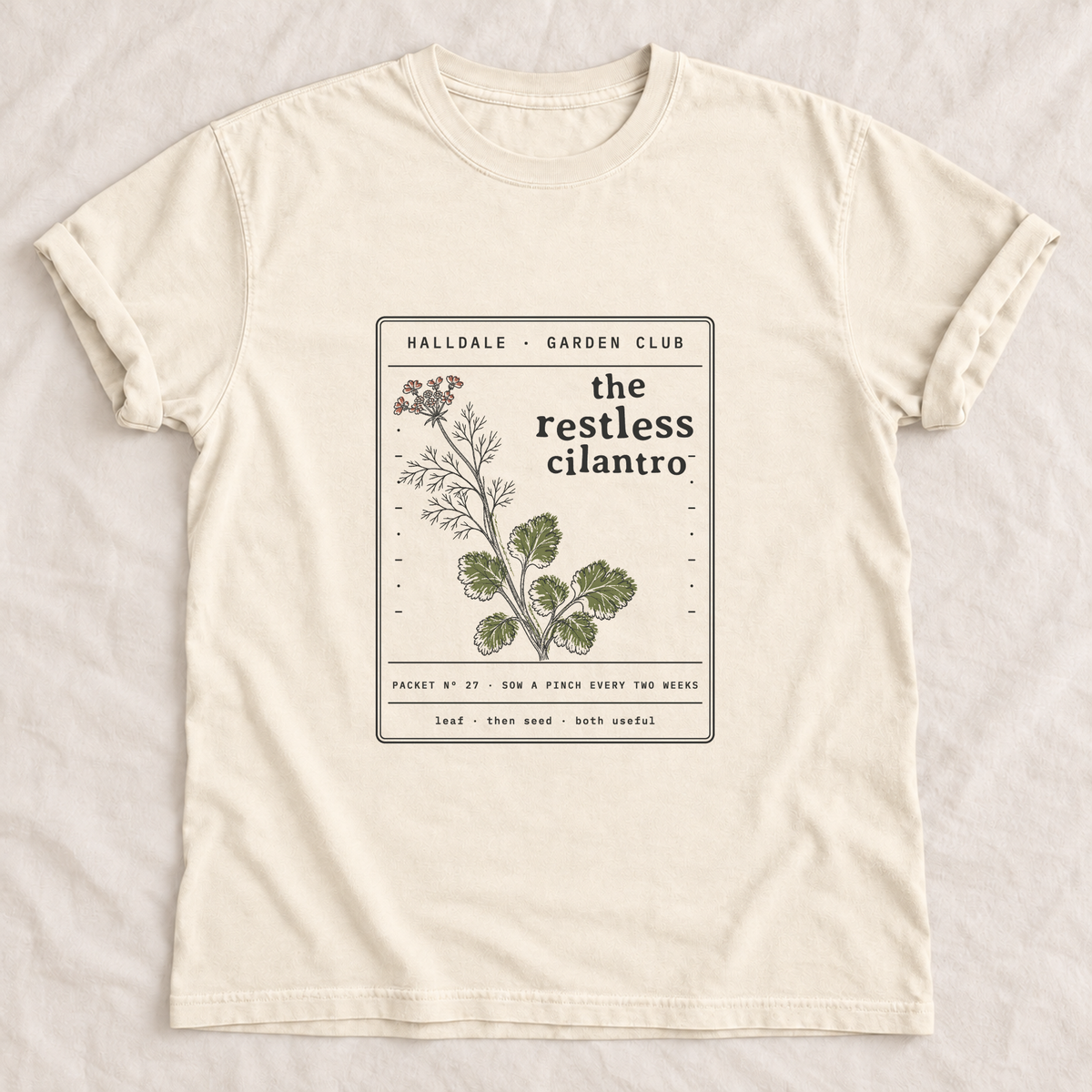 The Restless Cilantro tee in Ivory, laid flat