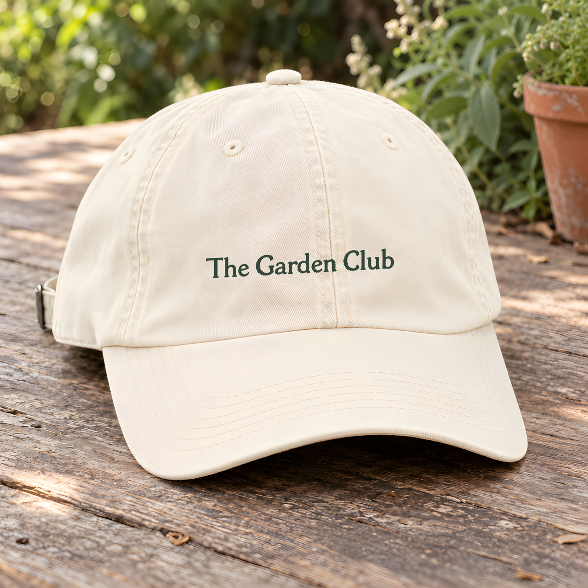The Garden Cap in Ivory, on a hanger