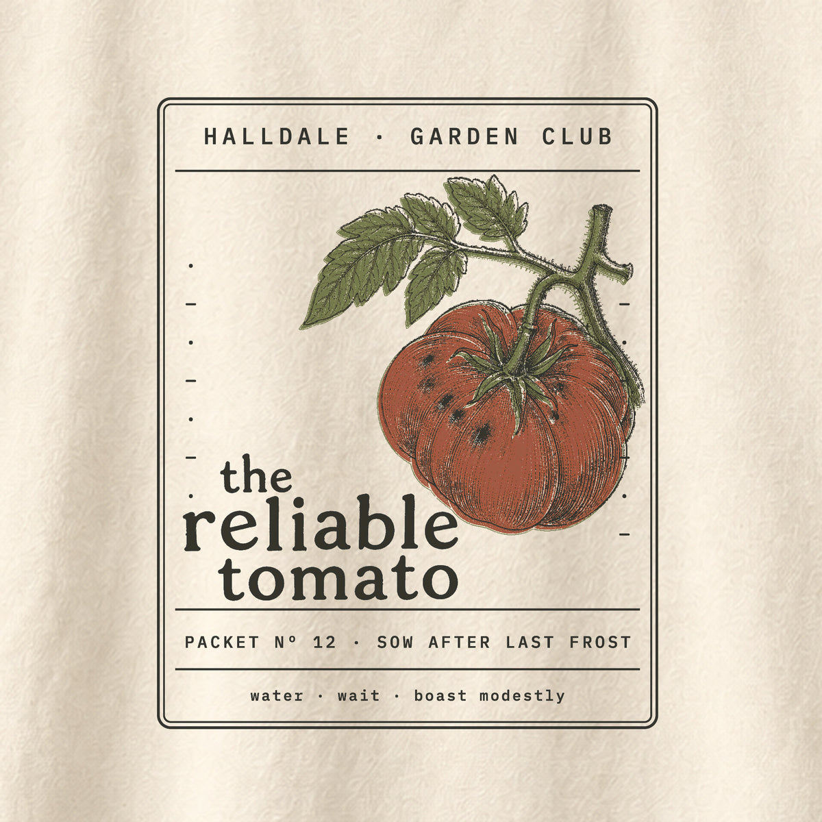 The Reliable Tomato tee in Ivory, close-up of the print