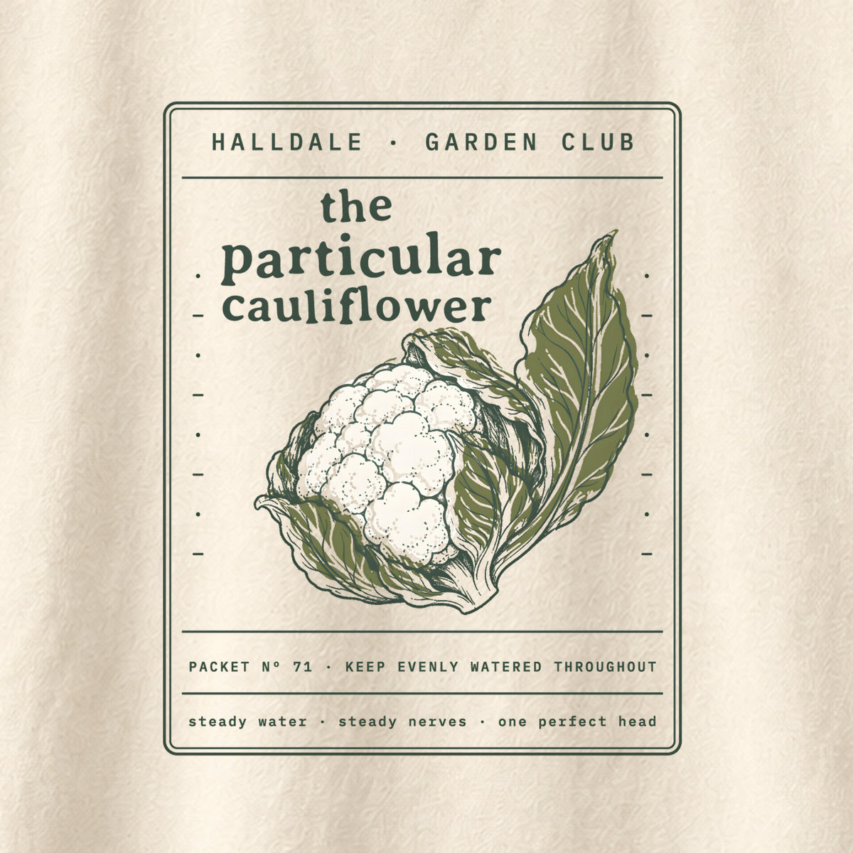 The Particular Cauliflower tee in Ivory, close-up of the print