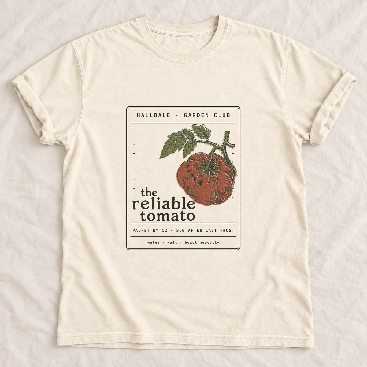 The Reliable Tomato tee in Ivory, laid flat