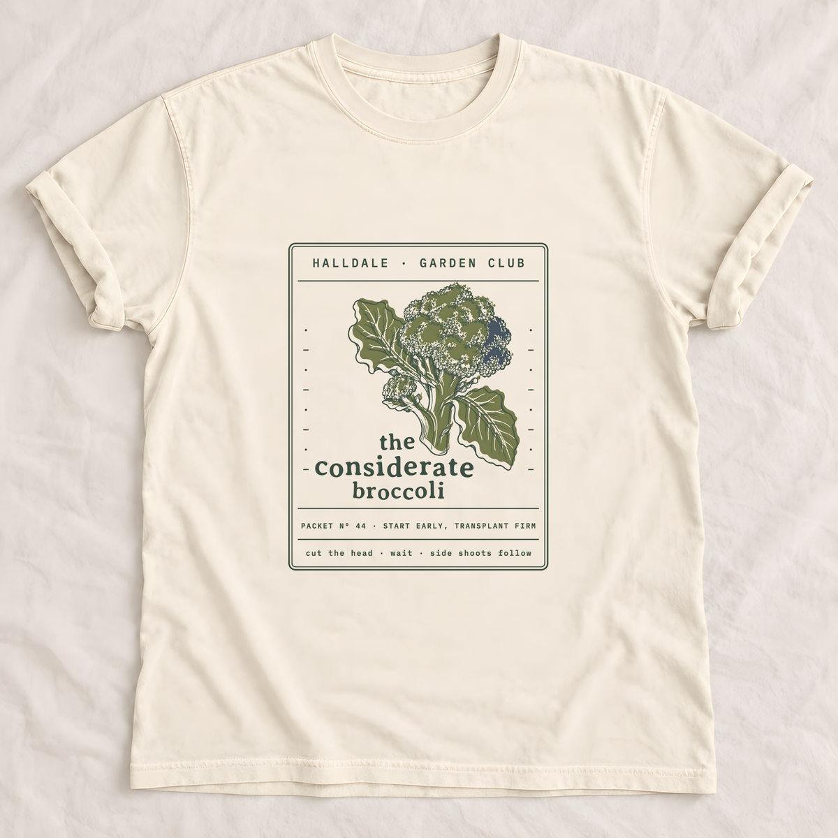 The Considerate Broccoli tee in Ivory, laid flat