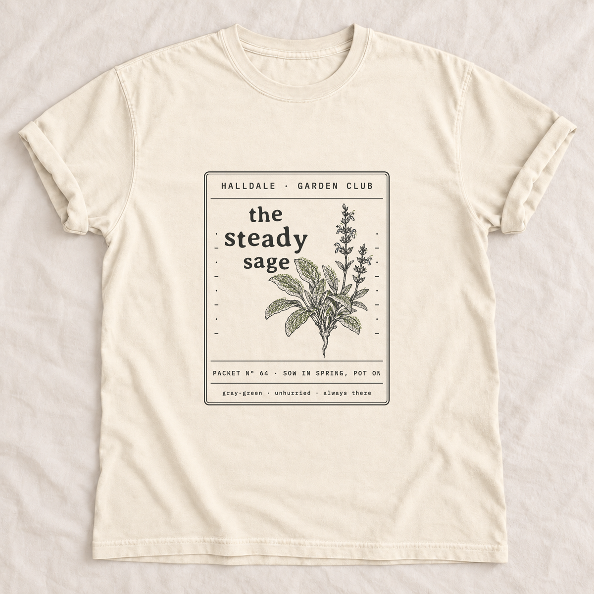 The Steady Sage tee in Ivory, laid flat