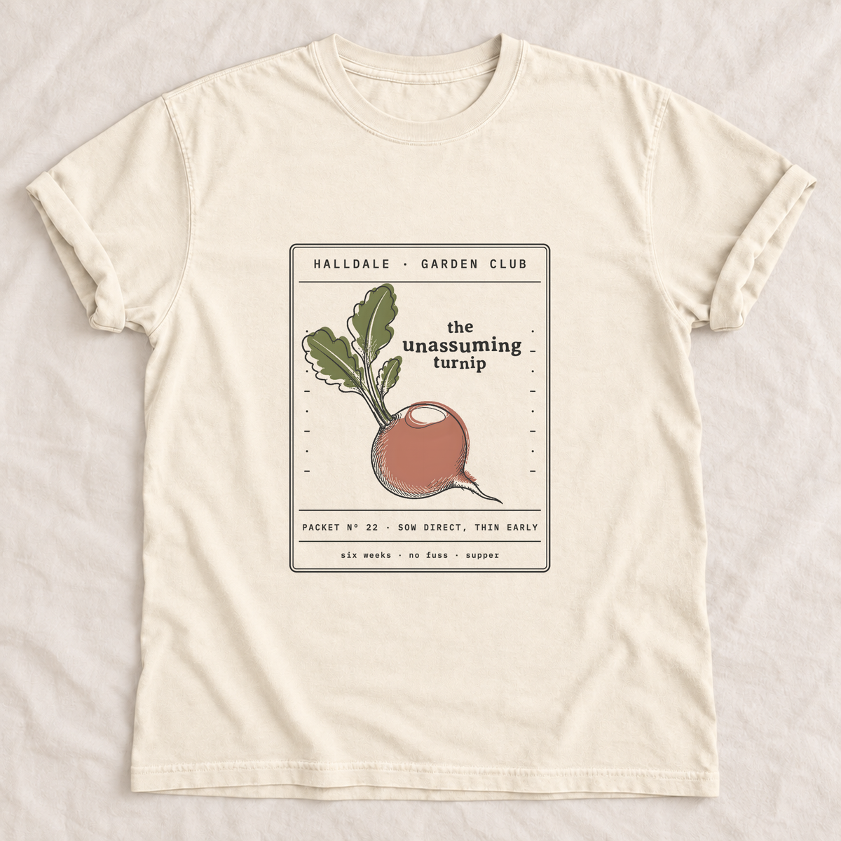 The Unassuming Turnip tee in Ivory, laid flat