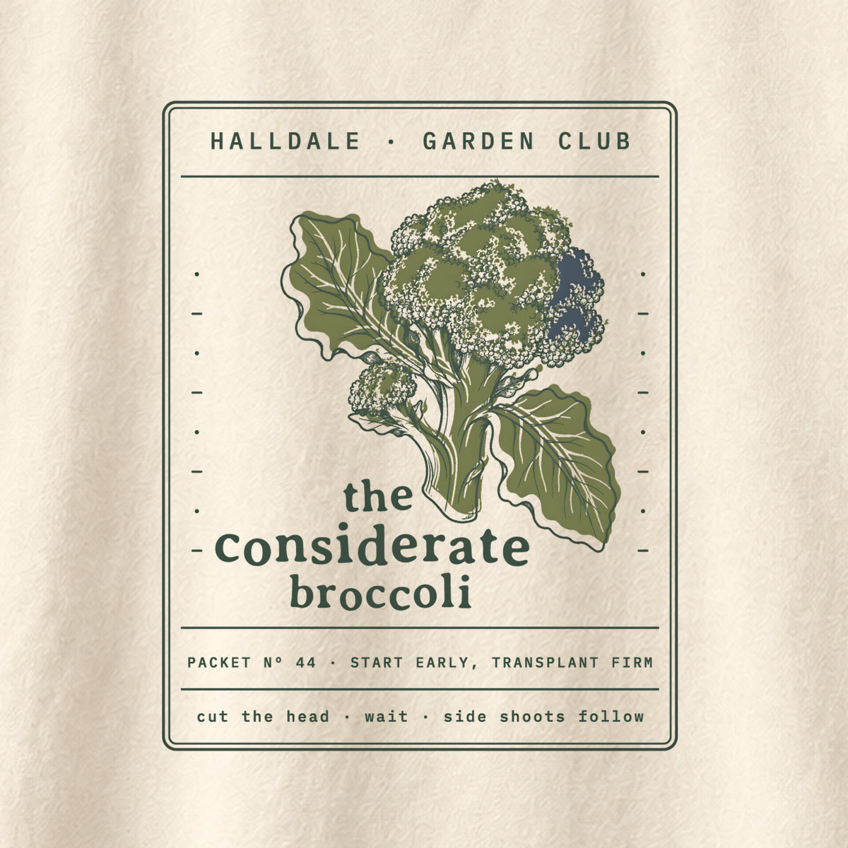 The Considerate Broccoli tee in Ivory, close-up of the print
