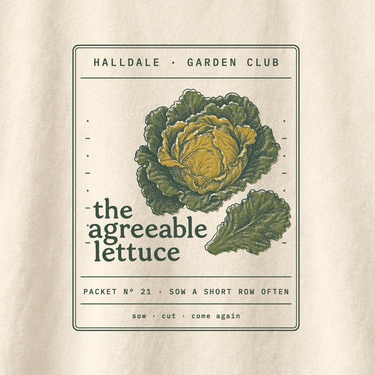 The Agreeable Lettuce tee in Ivory, close-up of the print