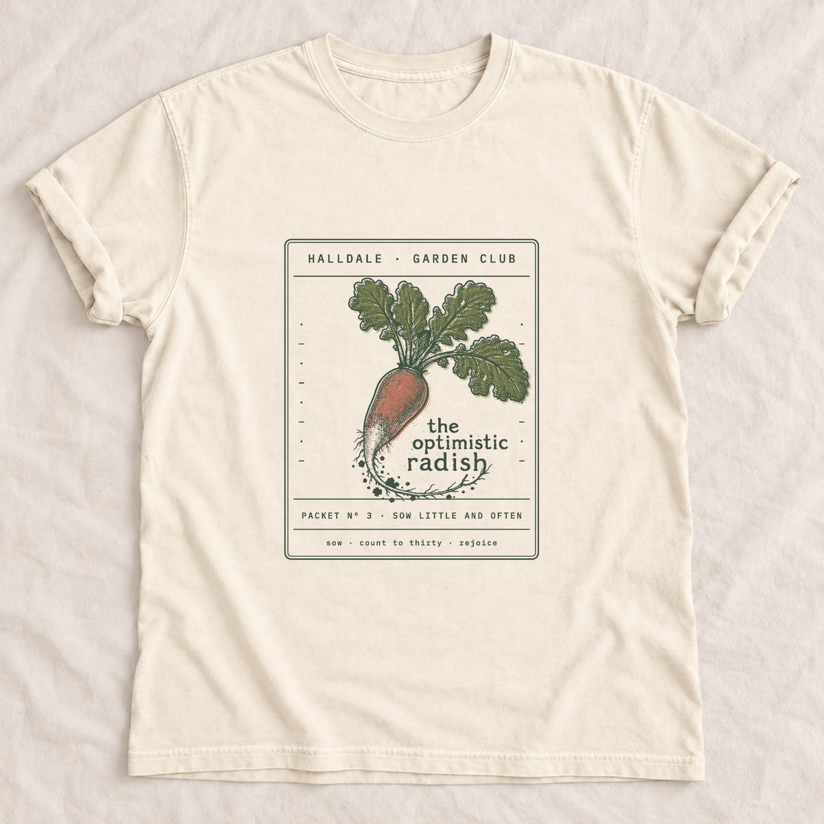 The Optimistic Radish tee in Ivory, laid flat