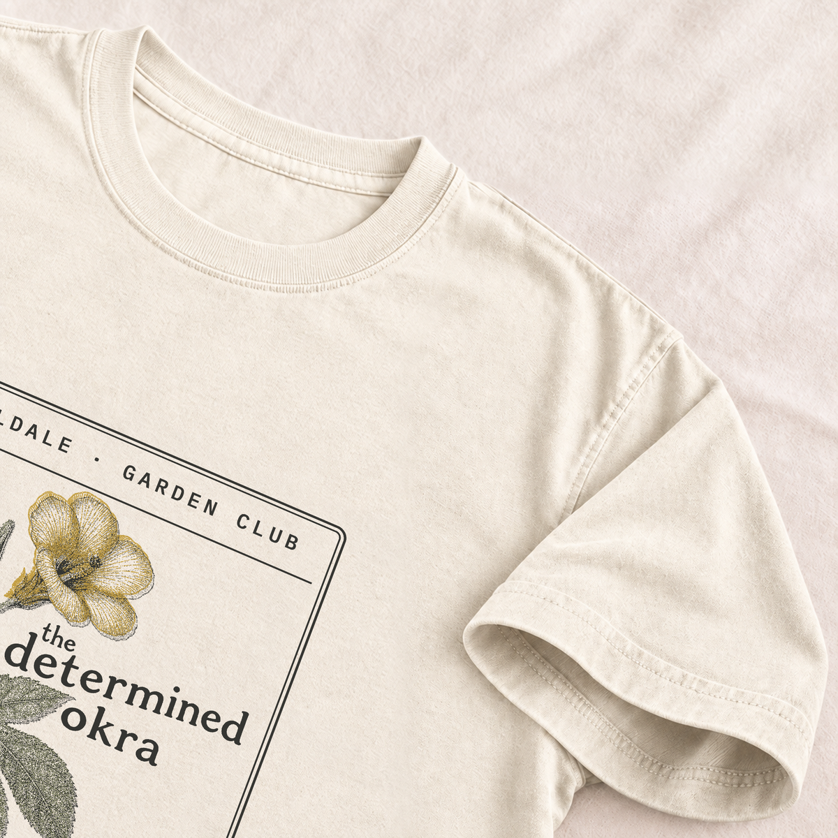 The Determined Okra tee in Ivory, detail