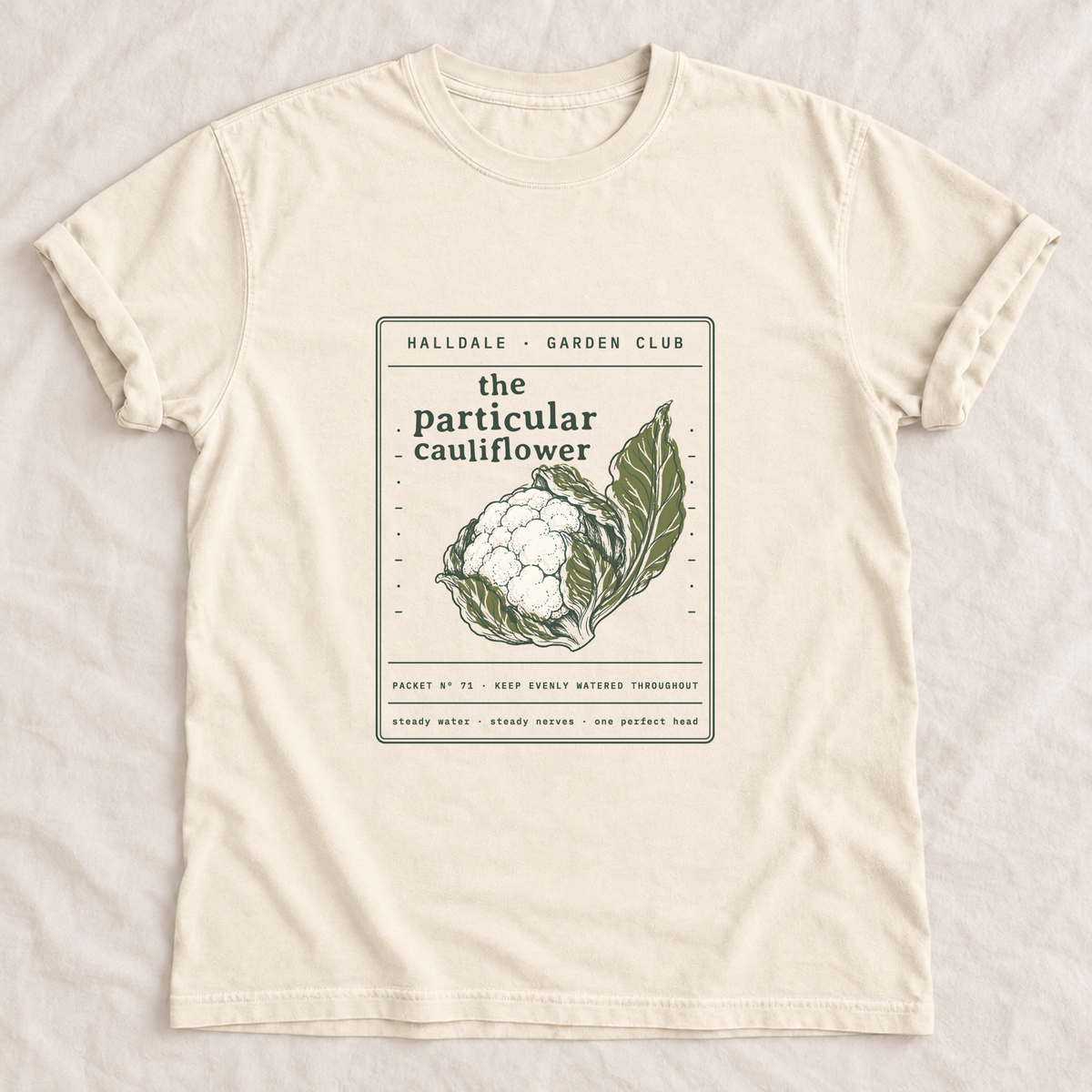 The Particular Cauliflower tee in Ivory, laid flat