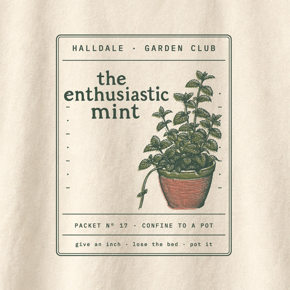 The Enthusiastic Mint tee in Ivory, close-up of the print