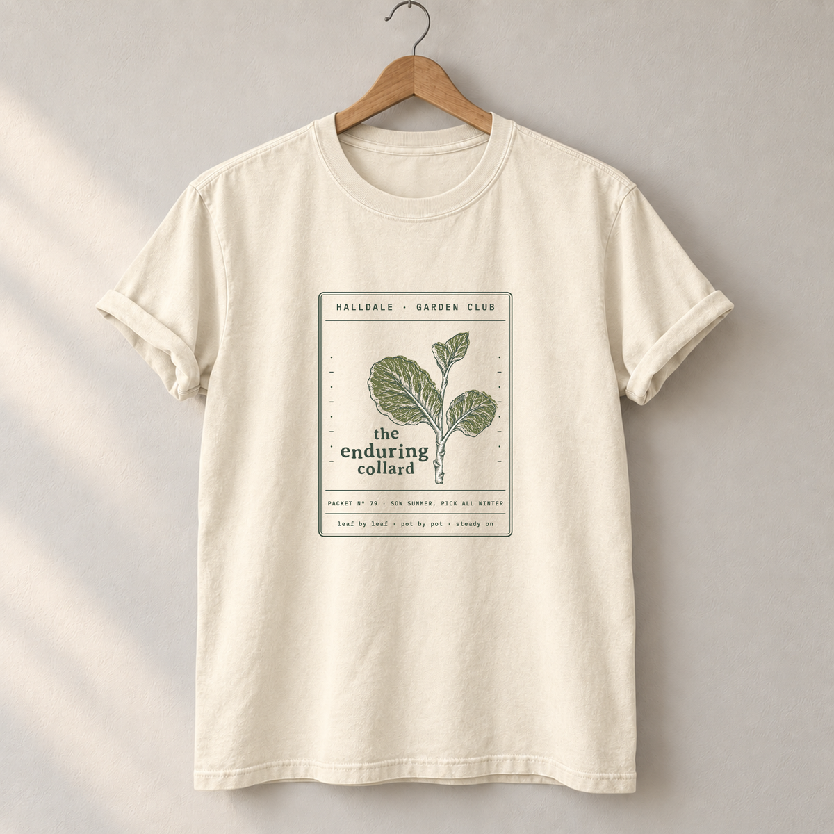The Enduring Collard tee in Ivory, on a hanger