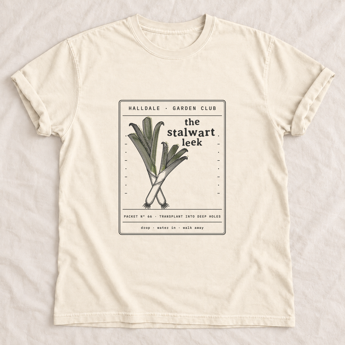 The Stalwart Leek tee in Ivory, laid flat
