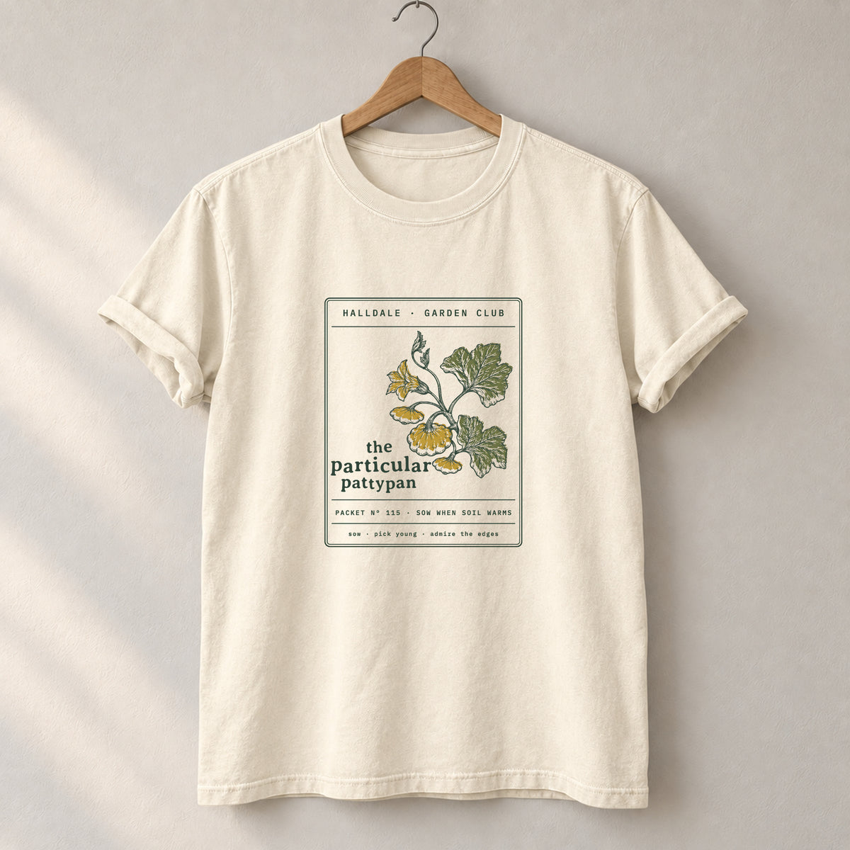 The Particular Pattypan tee in Ivory, on a hanger