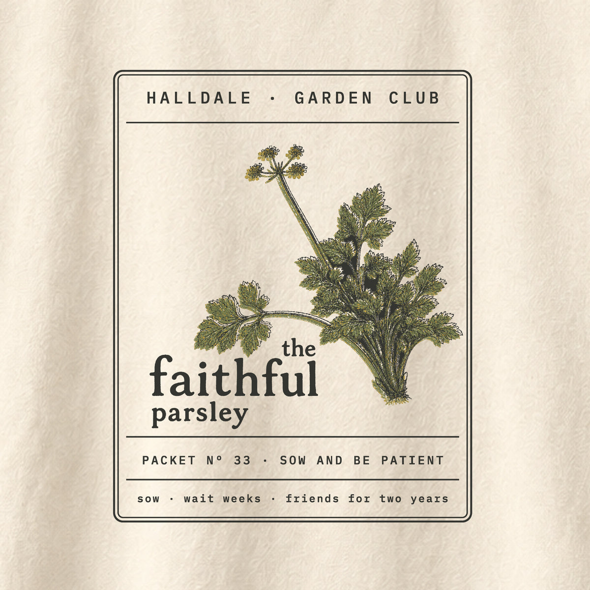 The Faithful Parsley tee in Ivory, close-up of the print