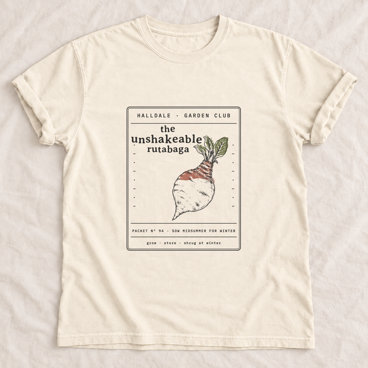 The Unshakeable Rutabaga tee in Ivory, laid flat