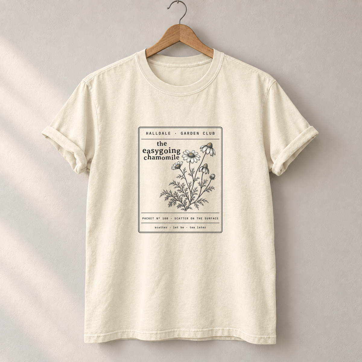 The Easygoing Chamomile tee in Ivory, on a hanger
