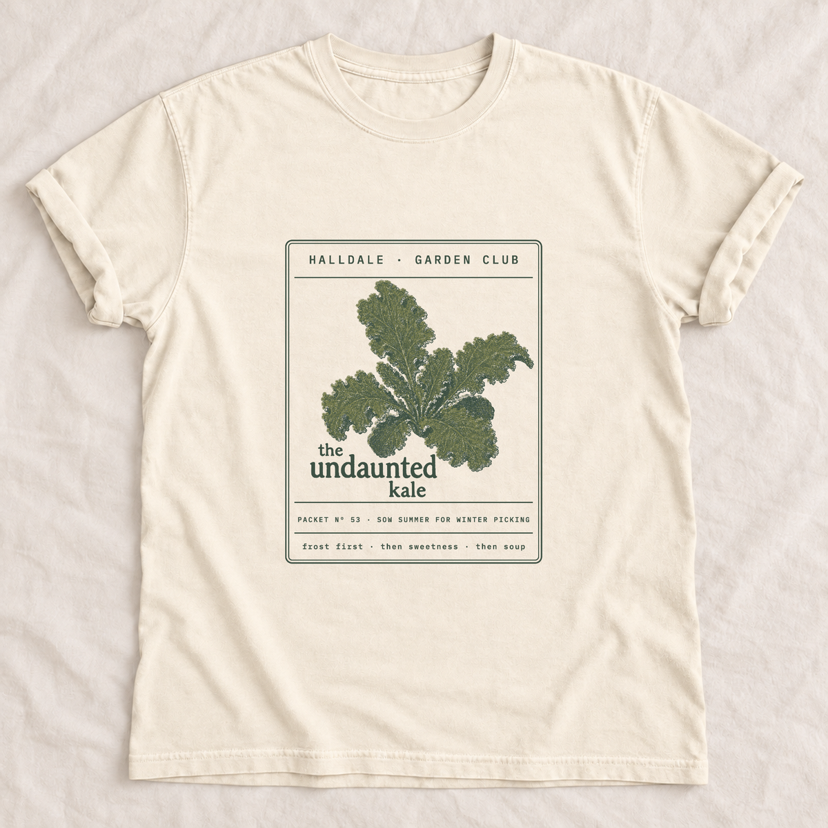 The Undaunted Kale tee in Ivory, laid flat