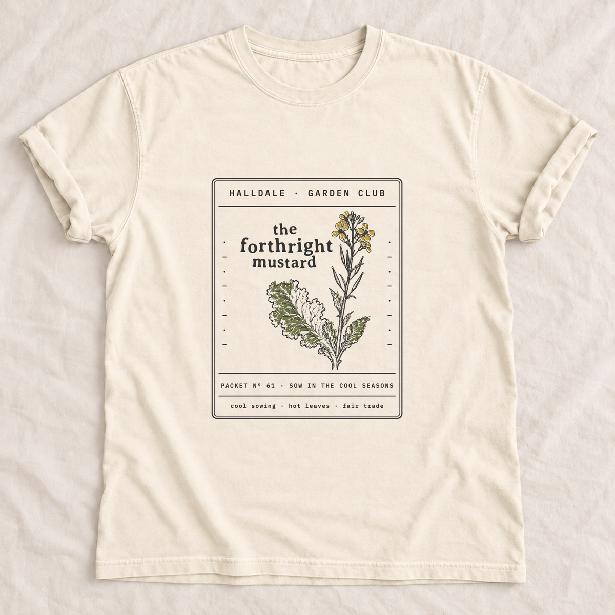 The Forthright Mustard tee in Ivory, laid flat