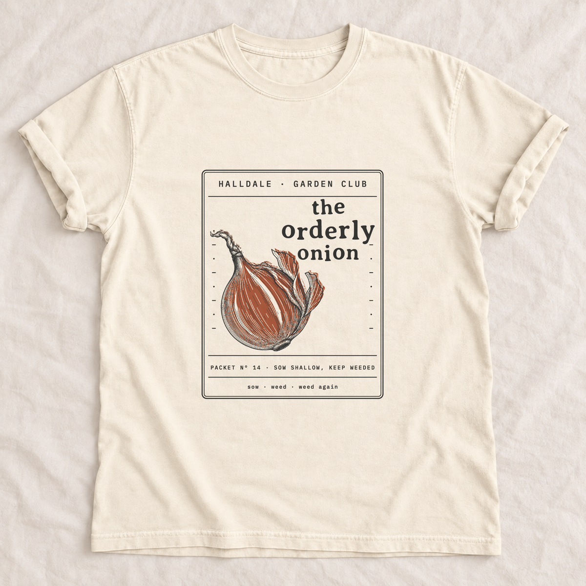 The Orderly Onion tee in Ivory, laid flat