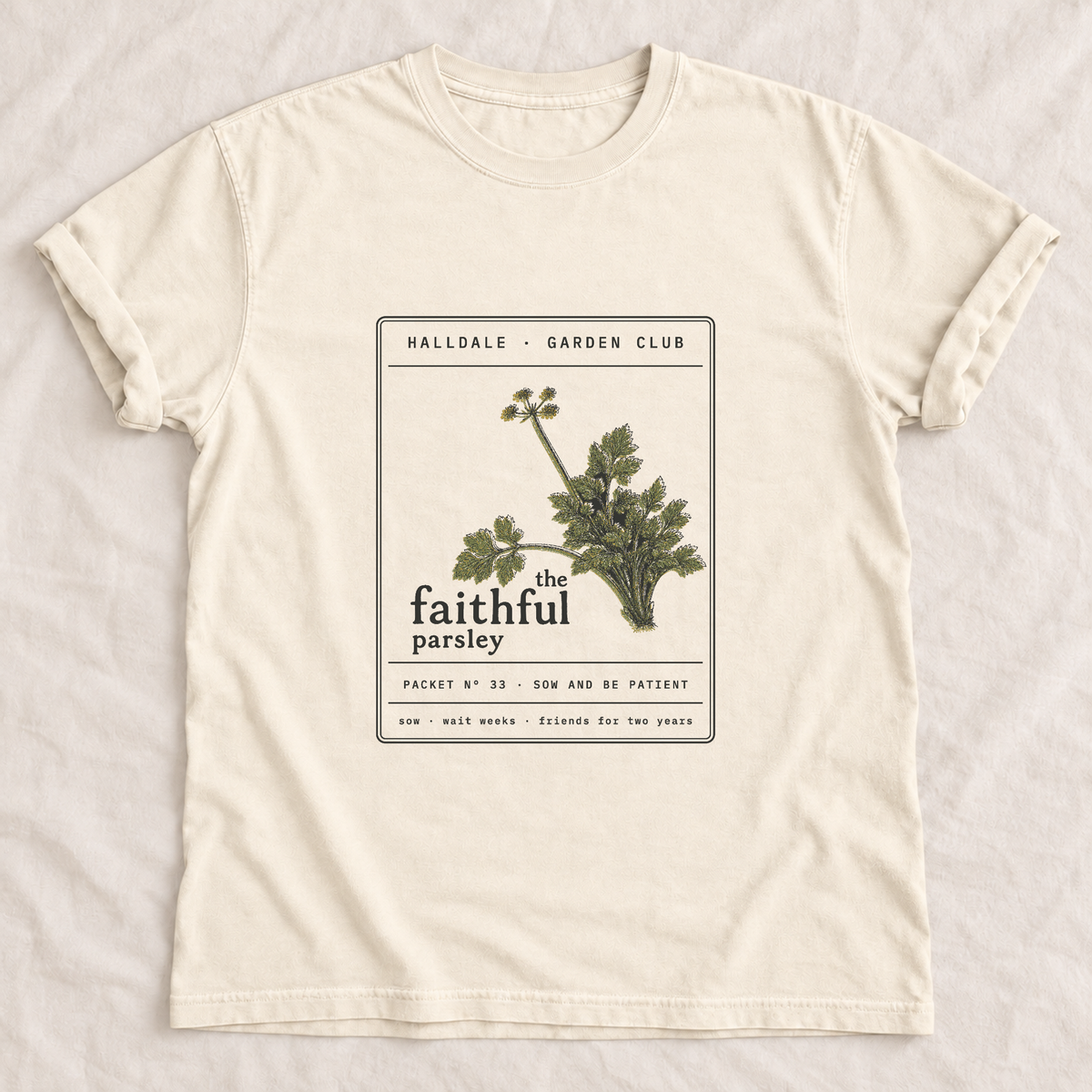 The Faithful Parsley tee in Ivory, laid flat