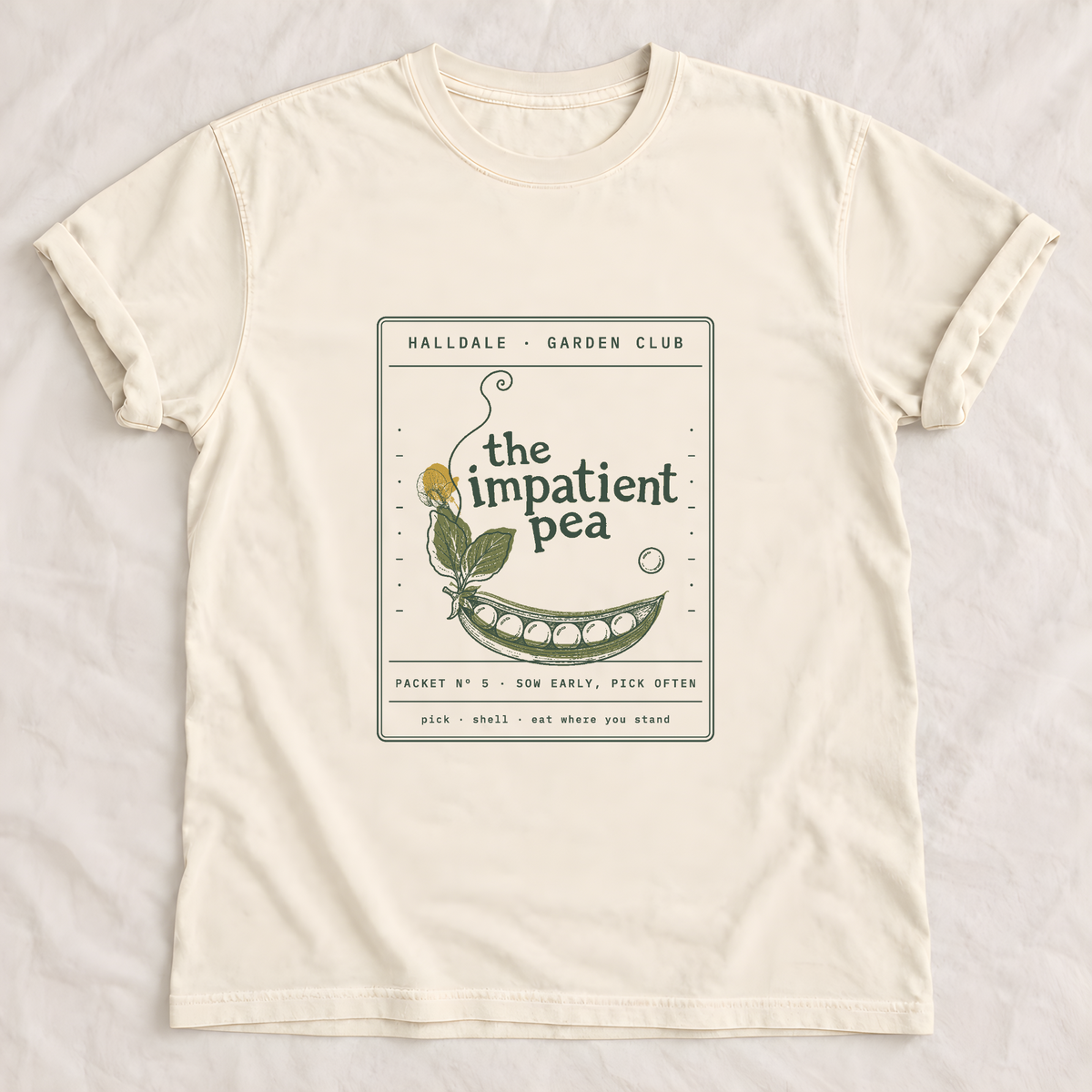 The Impatient Pea tee in Ivory, laid flat