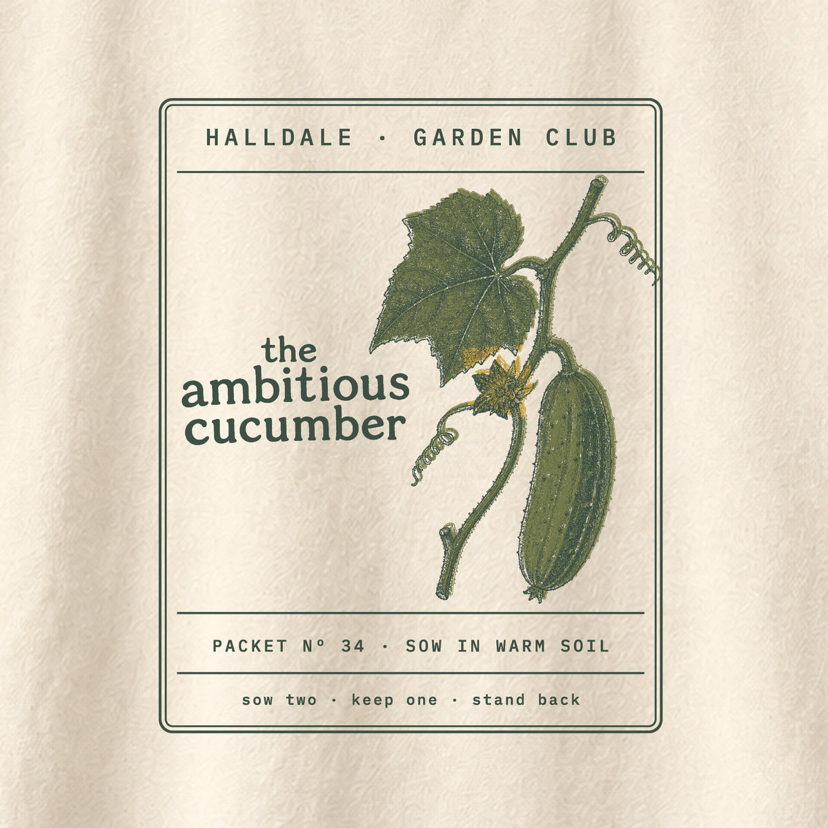 The Ambitious Cucumber tee in Ivory, close-up of the print
