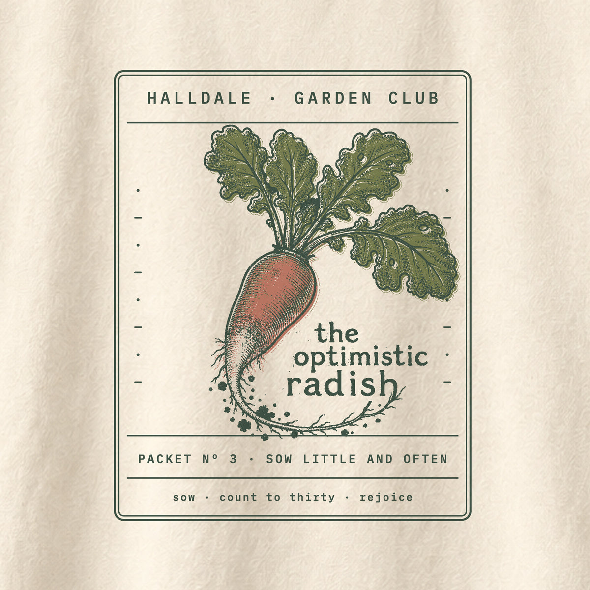 The Optimistic Radish tee in Ivory, close-up of the print